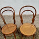 Set of 10 bentwood bistro chairs with cane seat.