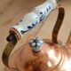 Vintage kettle in copper and ceramic