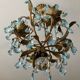 Antique Italian chandelier with cage and blue tassels