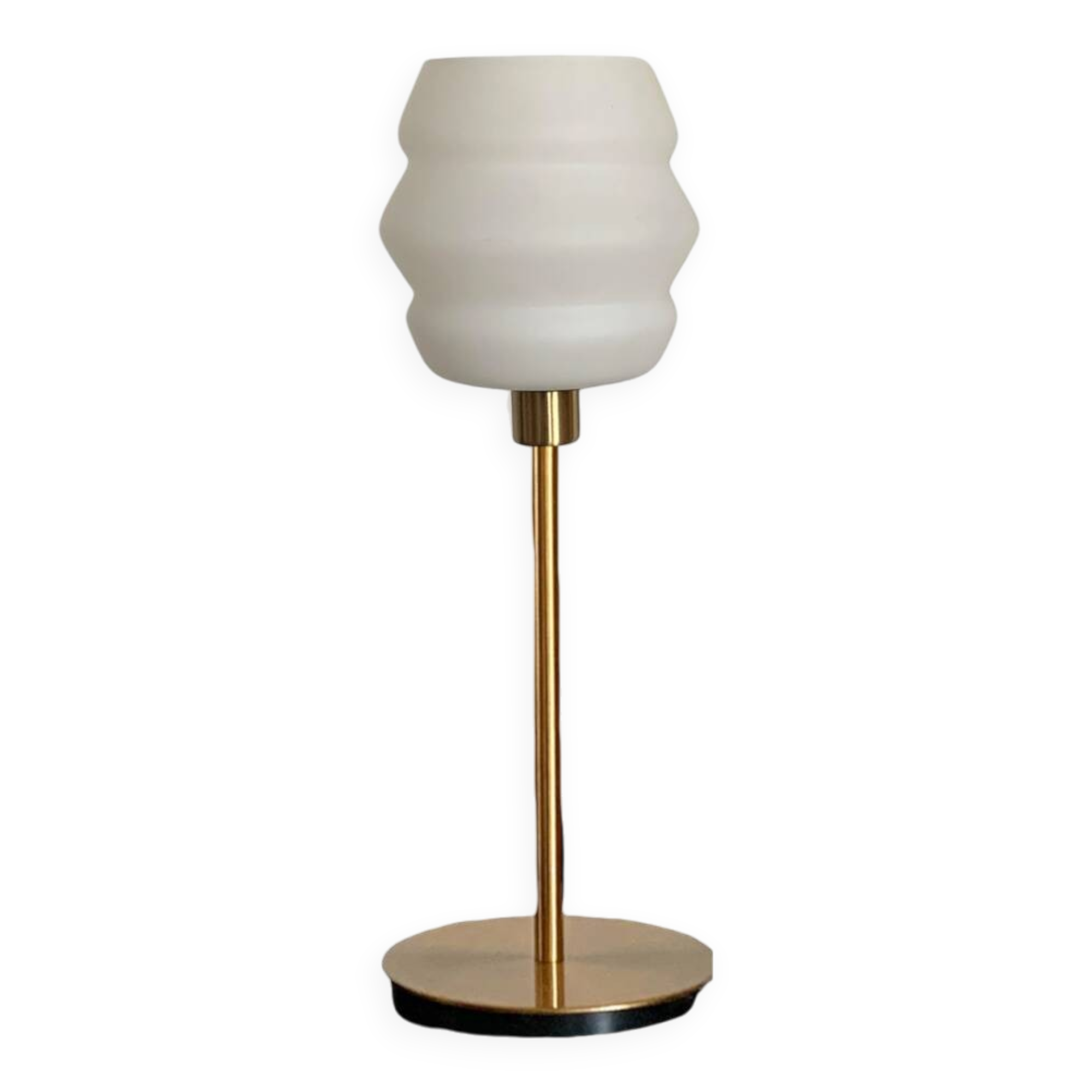 Table lamp with a vintage white glass globe and a golden base