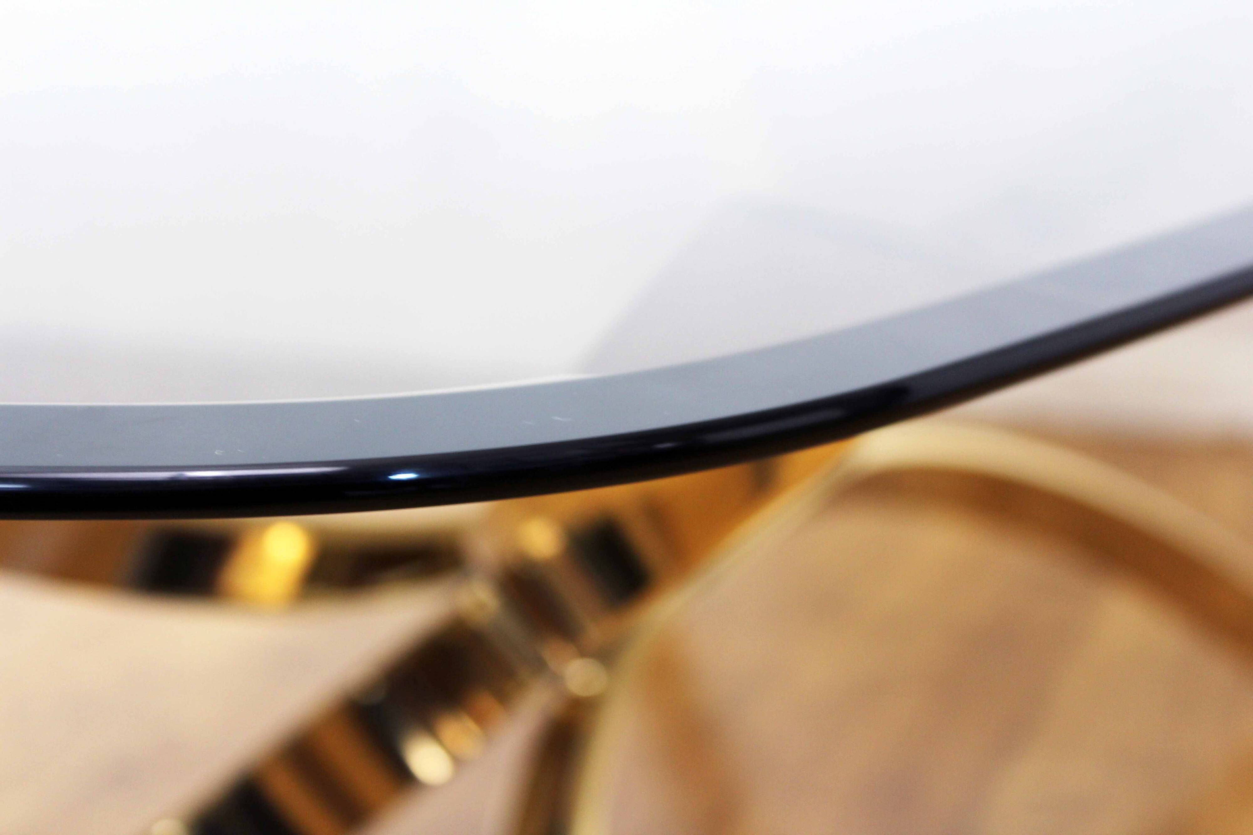 Italian coffee table in smoked glass and brass