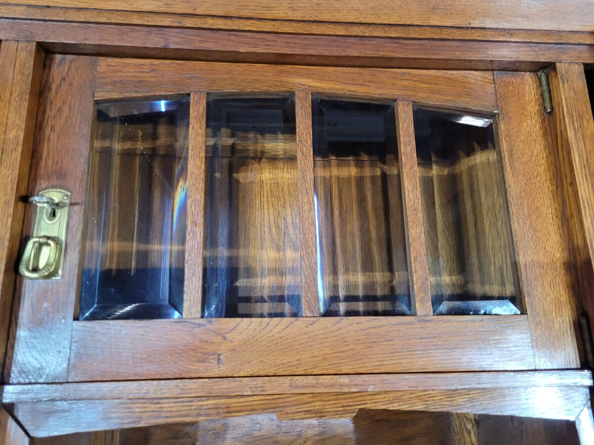 Glass-fronted oak sideboard from the Art Nouveau period.