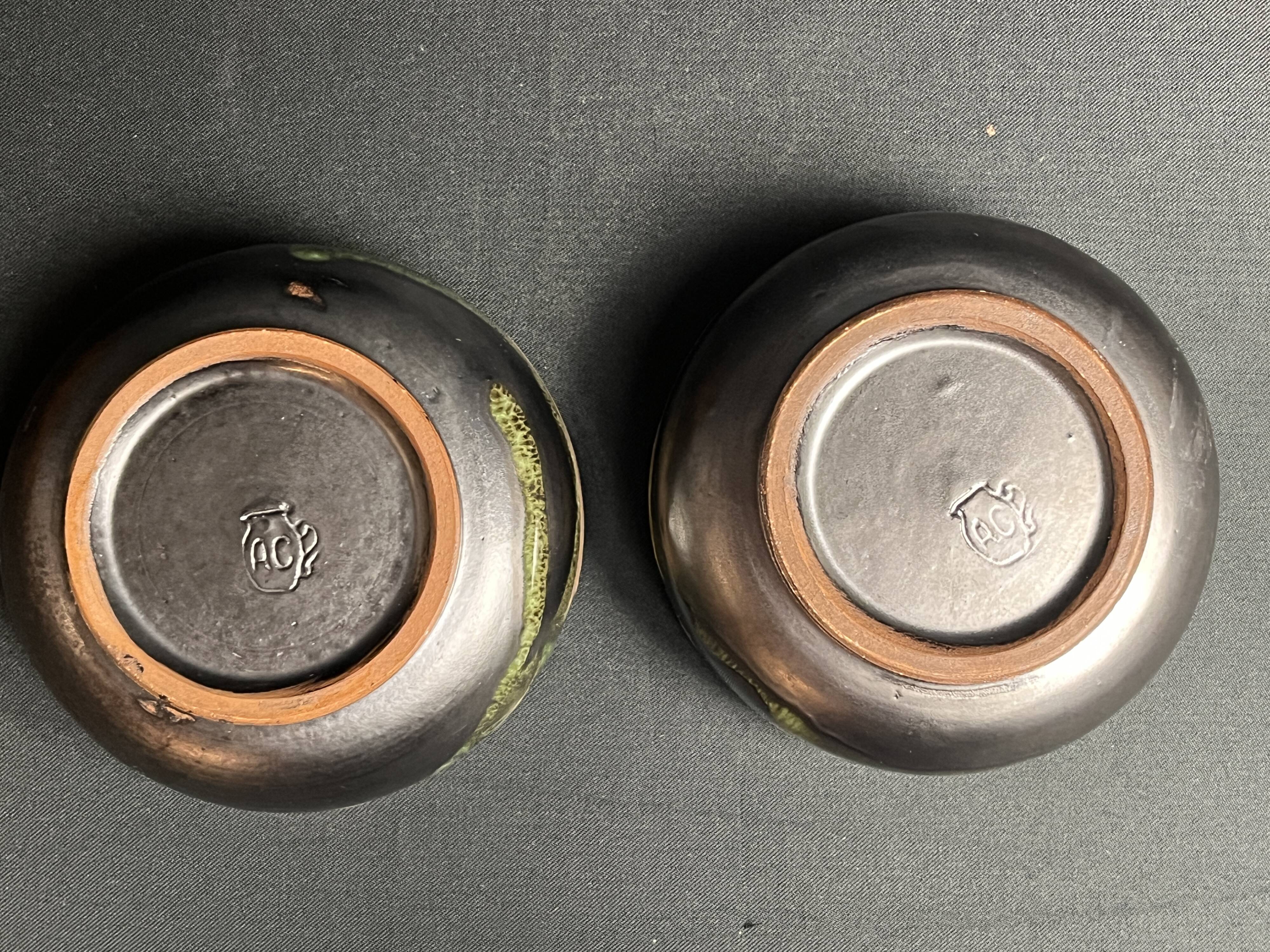 Vintage, two flamed stoneware bowls from the 20th century.