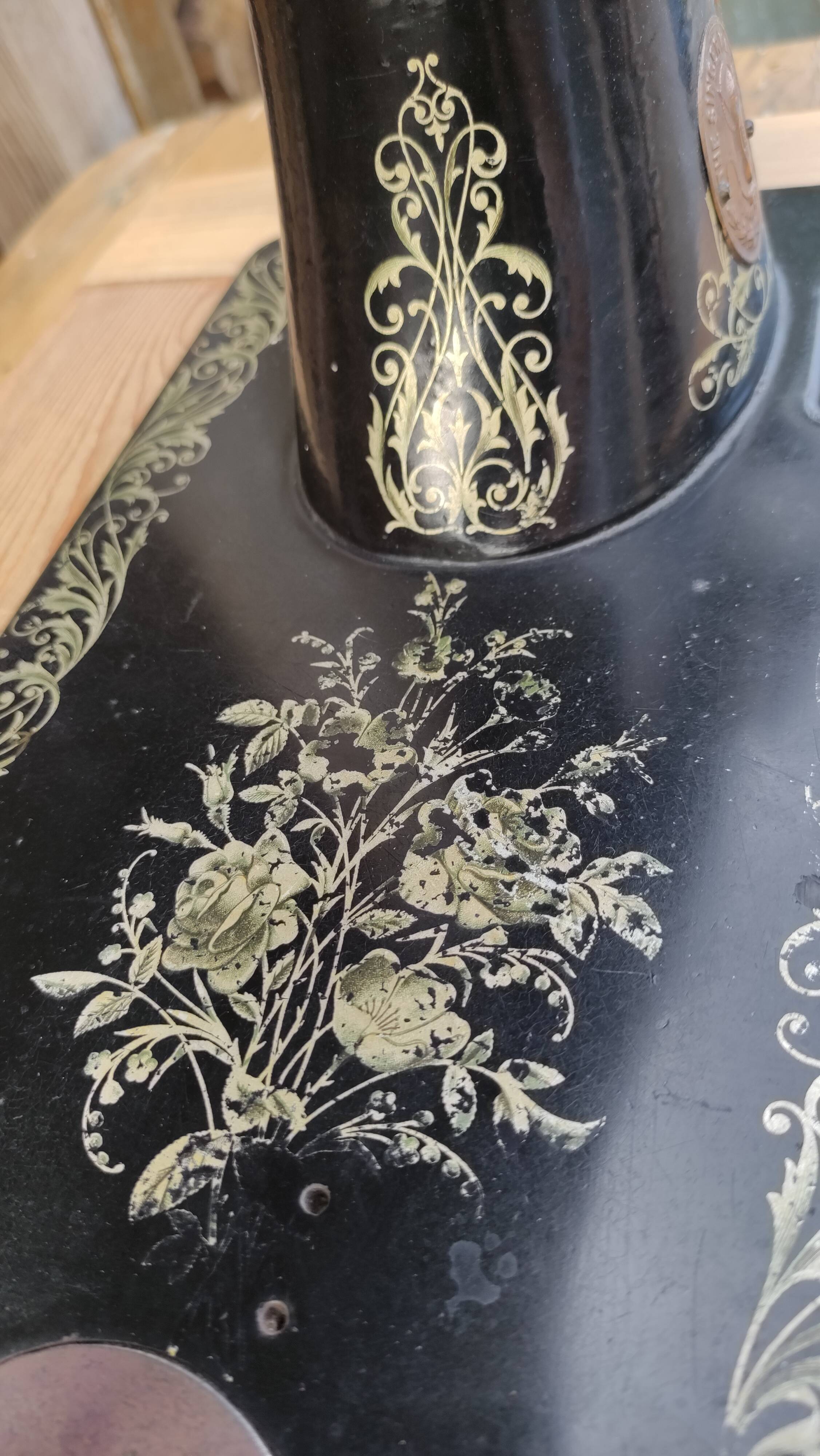 Old Singer sewing machine on pedestal