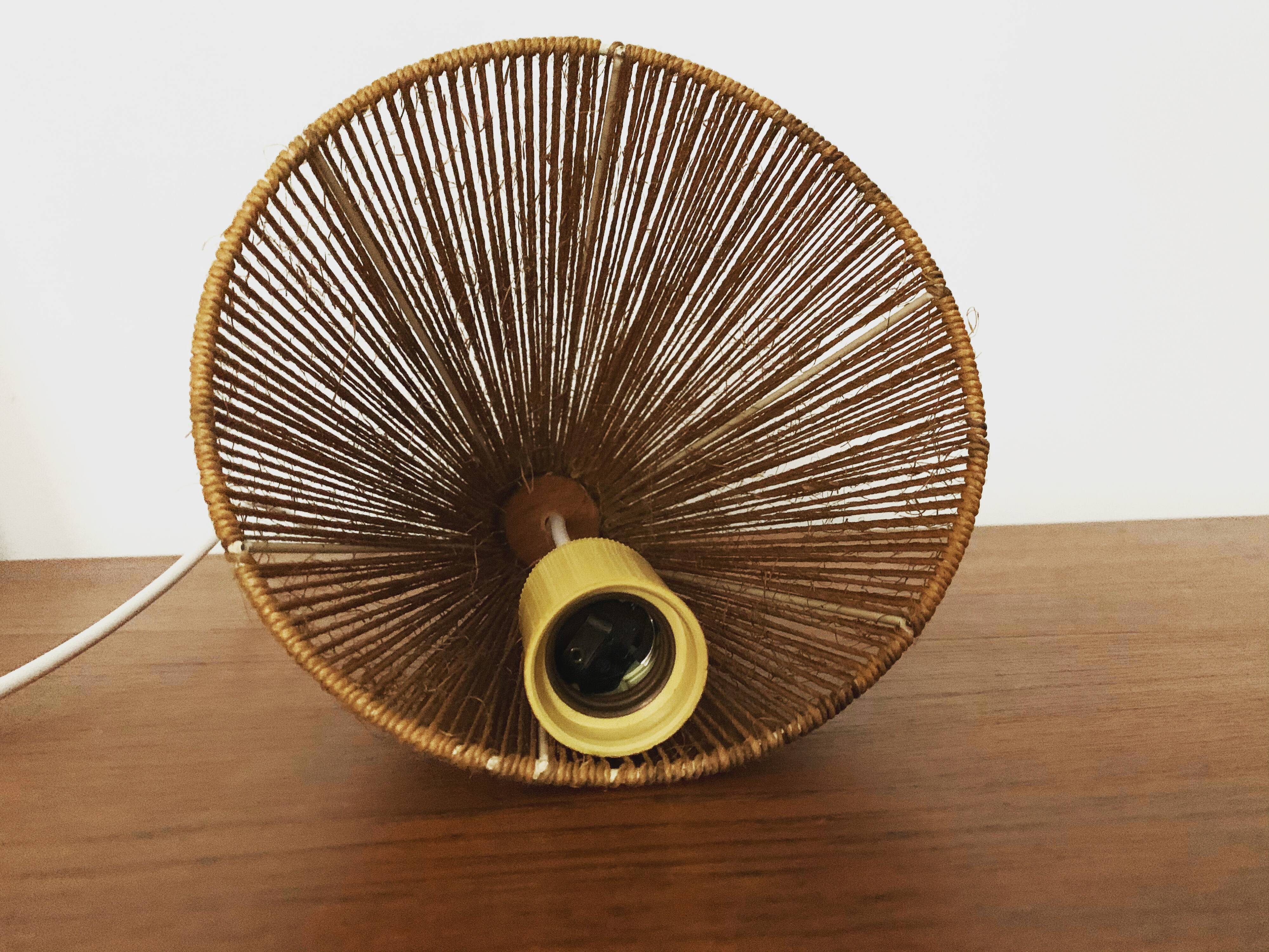 Teakwood and raffia bast cascading lamp by Rispal
