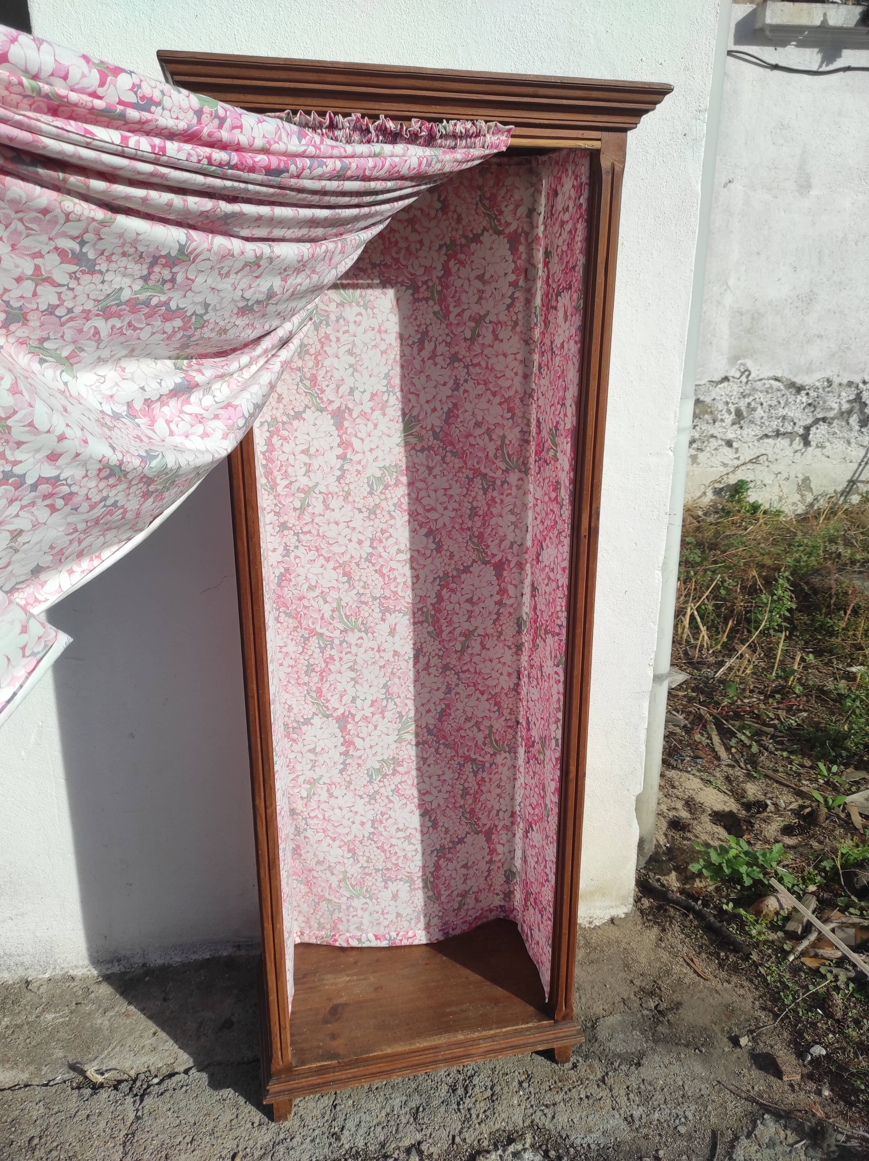 Old wardrobe in old wood and vintage fabric