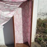 Old wardrobe in old wood and vintage fabric