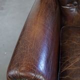 Classic grained cognac colored cowhide leather Chesterfield armchair