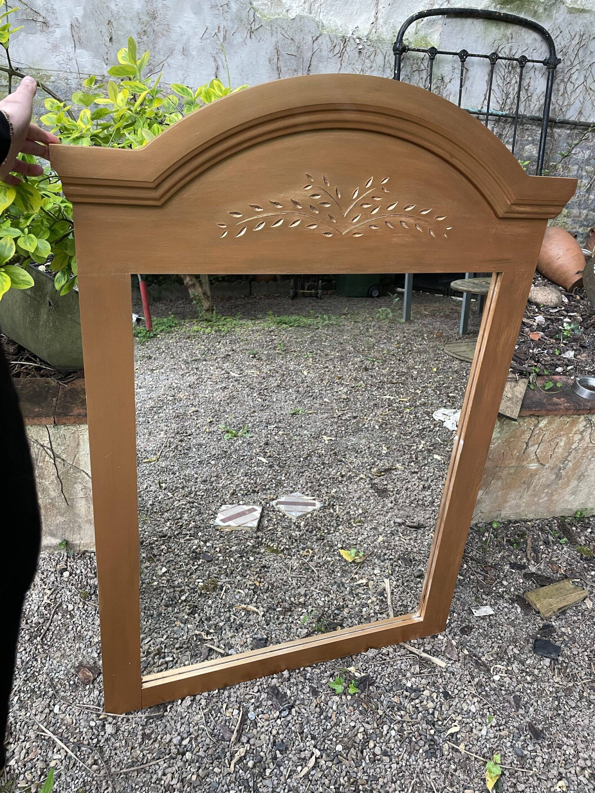 Golden mirror with wheat decoration