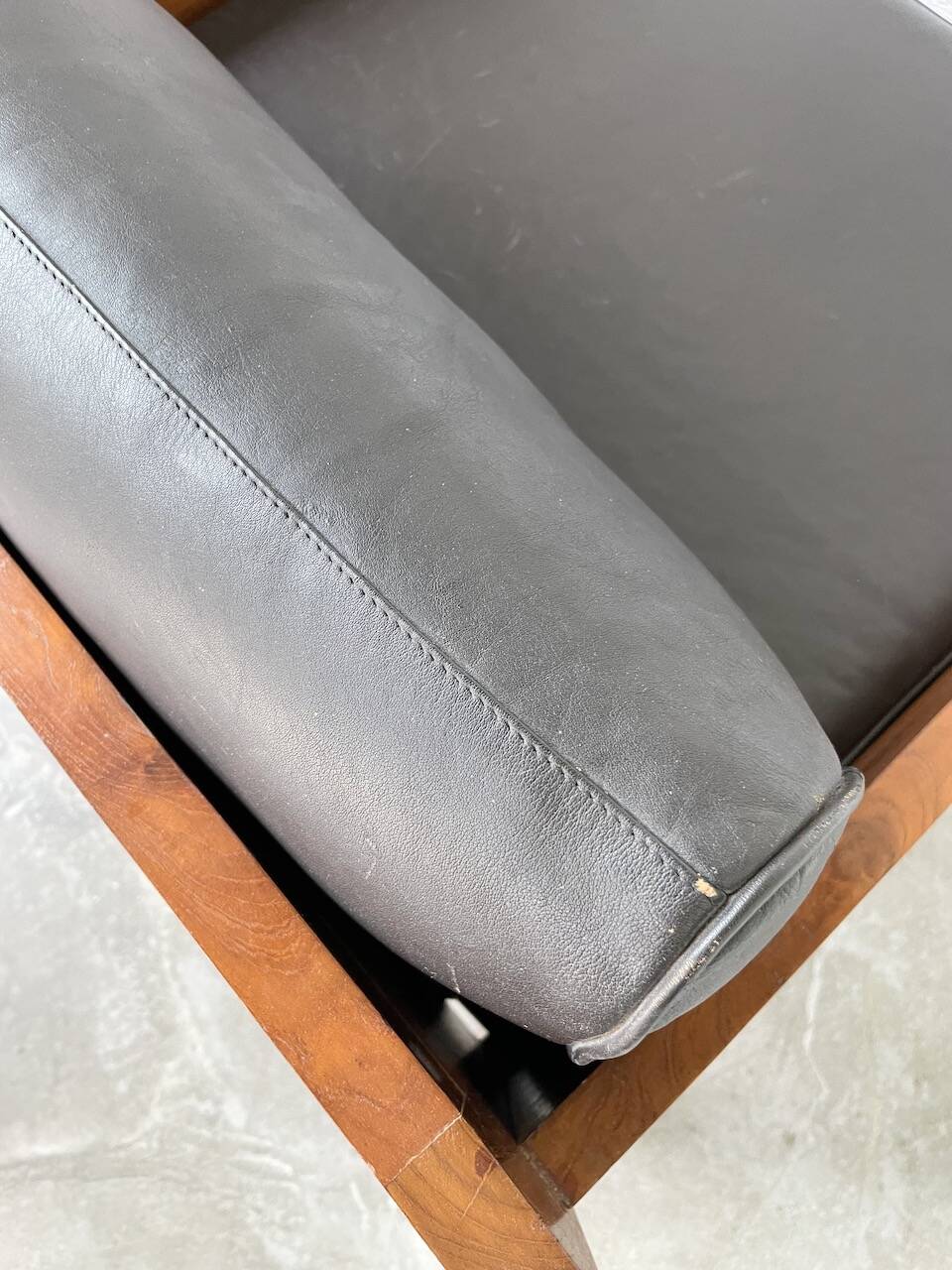 Modernist armchair in exotic wood and leather