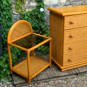 Dresser and its bedside table in rattan caning and vintage oak from the 1970s.