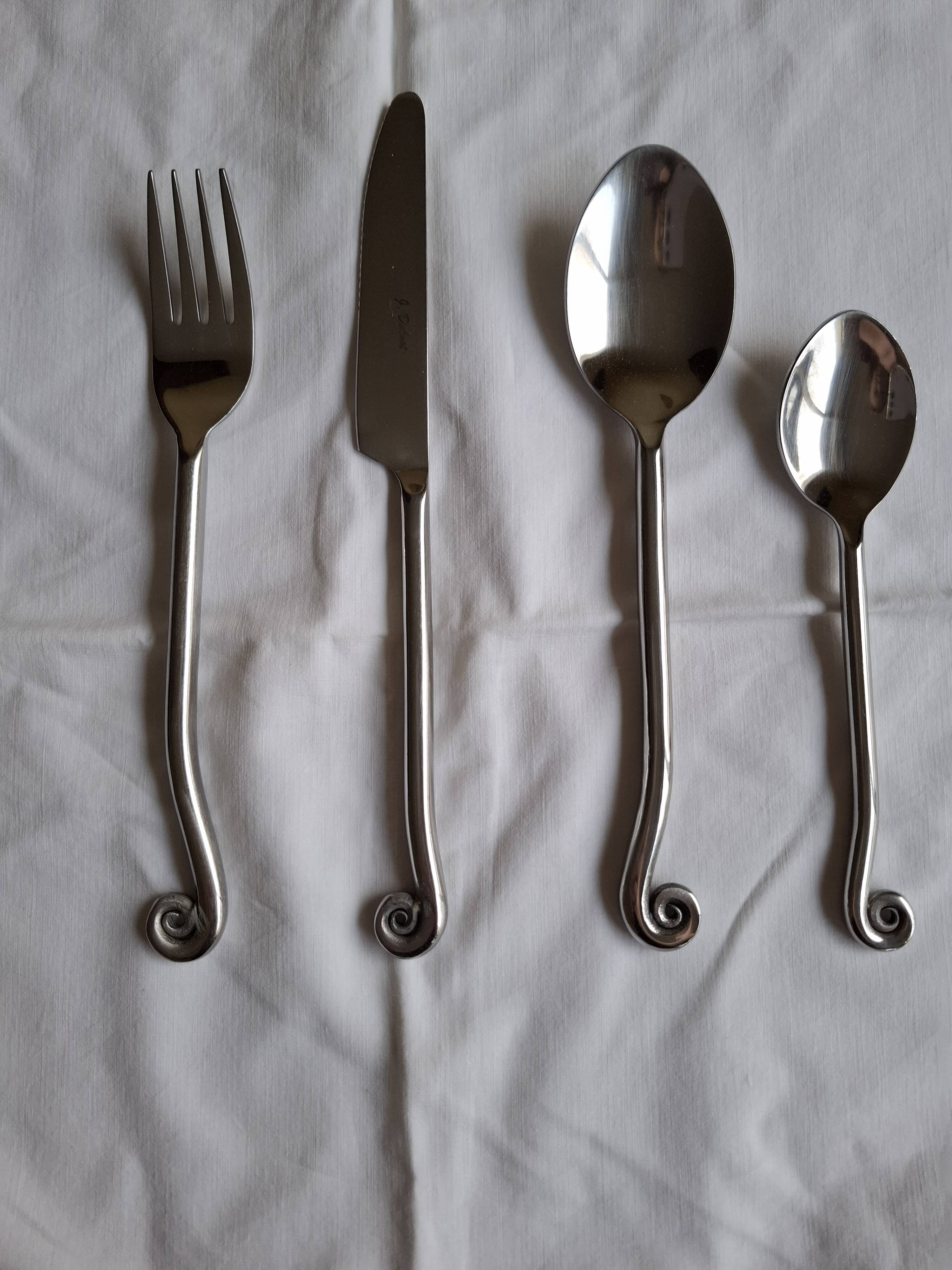 Twisted metal cutlery with a fancy spiral design.
