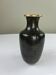Vase en laiton émaillé noir et doré