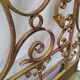 Golden wrought iron bedhead