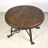 Brutalist round table in wrought iron and wood