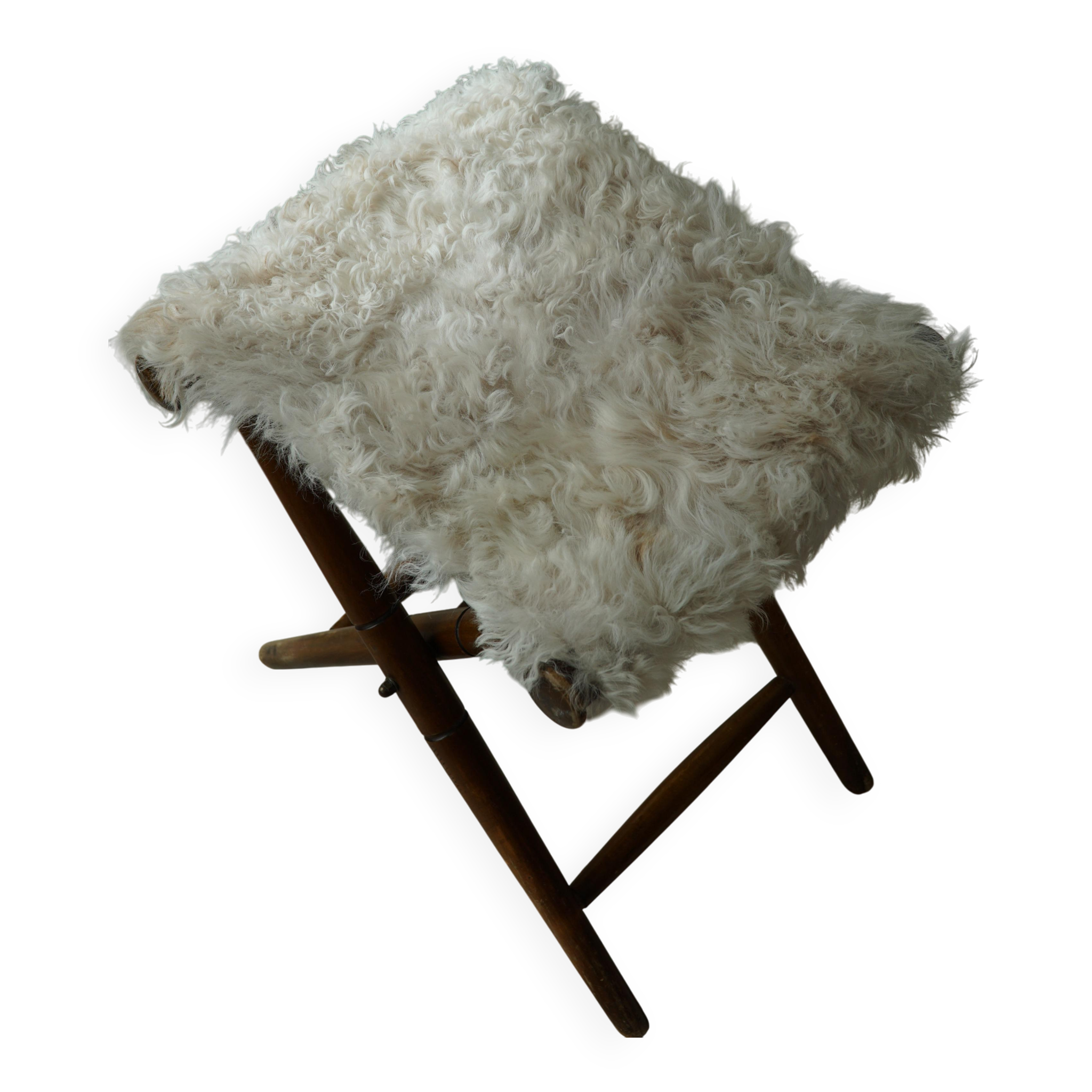 Folding stool, reupholstered in long-haired sheepskin, mid-century modern style, 1950s.