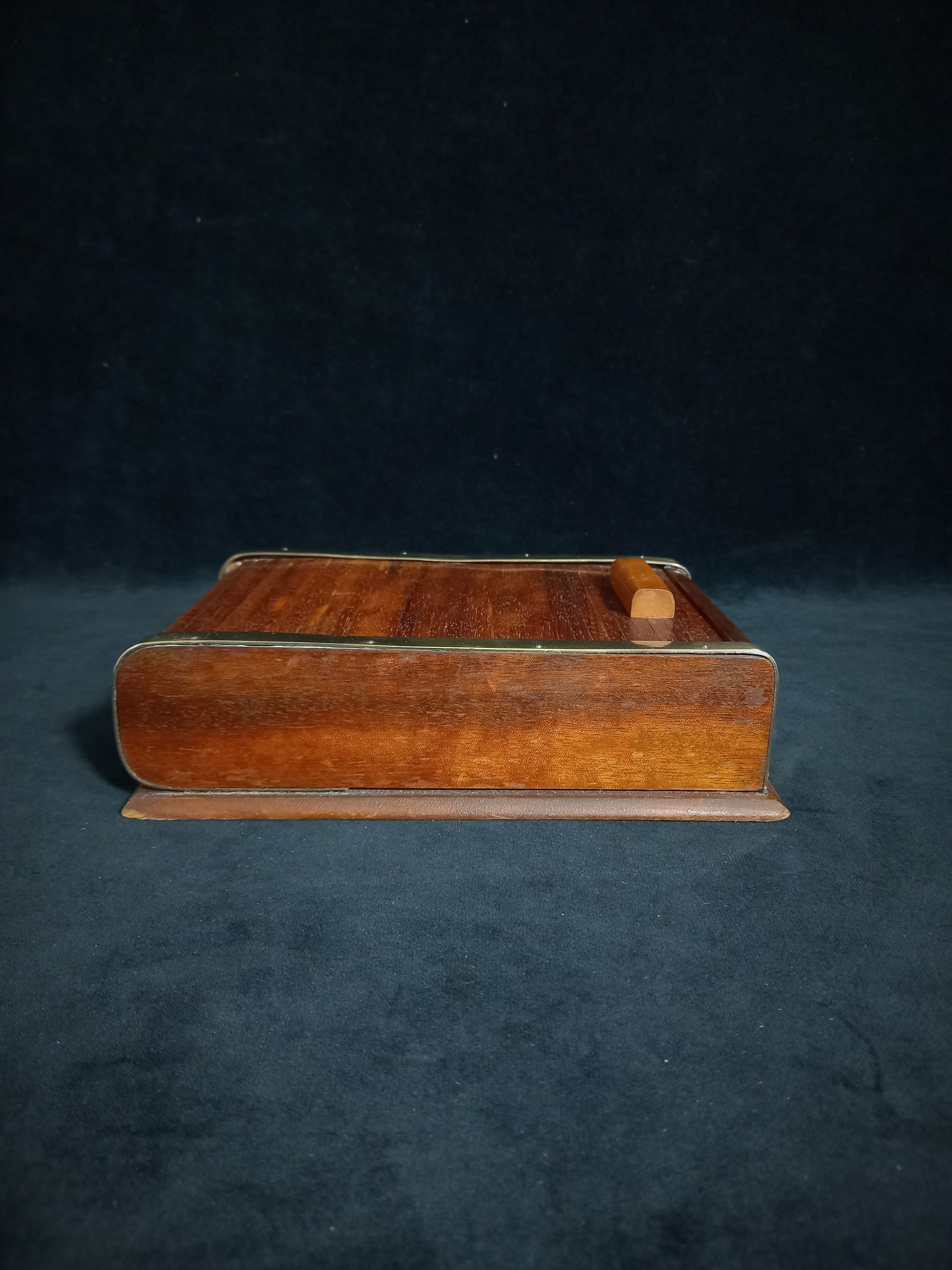 Art deco cigar box with sliding lid and brass finishes