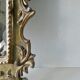Mirror with cherub head in gilded wood, Venetian baroque style