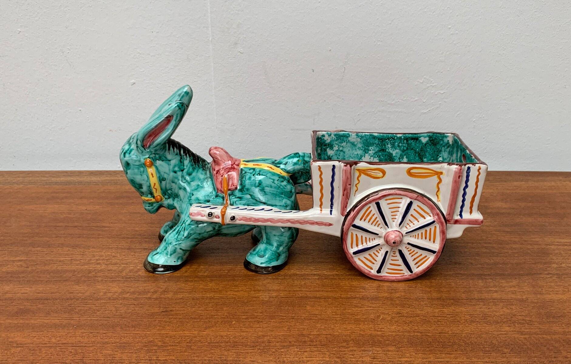 Vintage Italian hand-painted sculpture of a donkey with a cart in the shape of a bowl from Deruta, Italy.