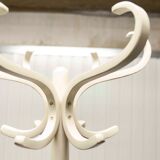 Parrot wears white Baumann coat 1970