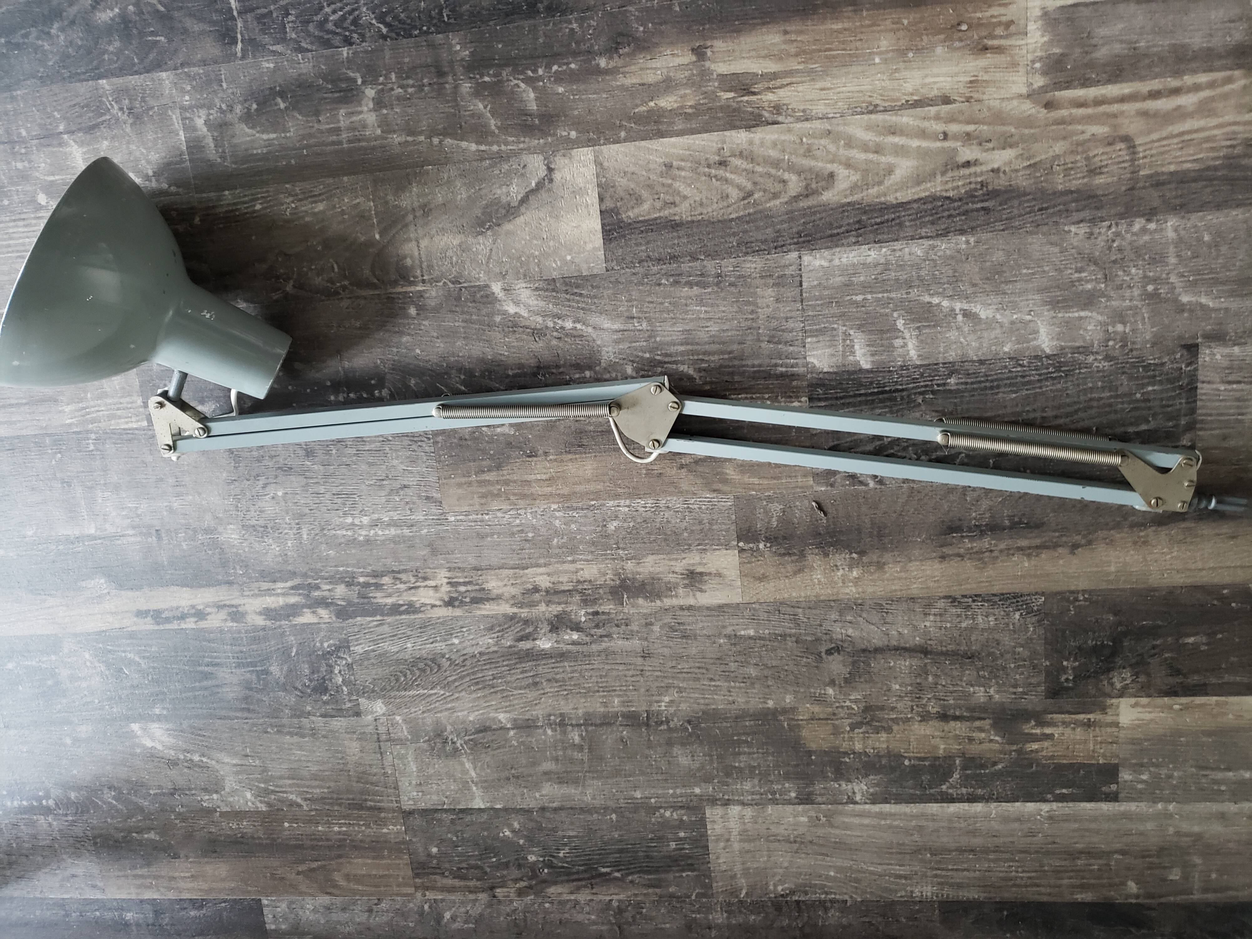 Grey articulated architect lamp to be restored