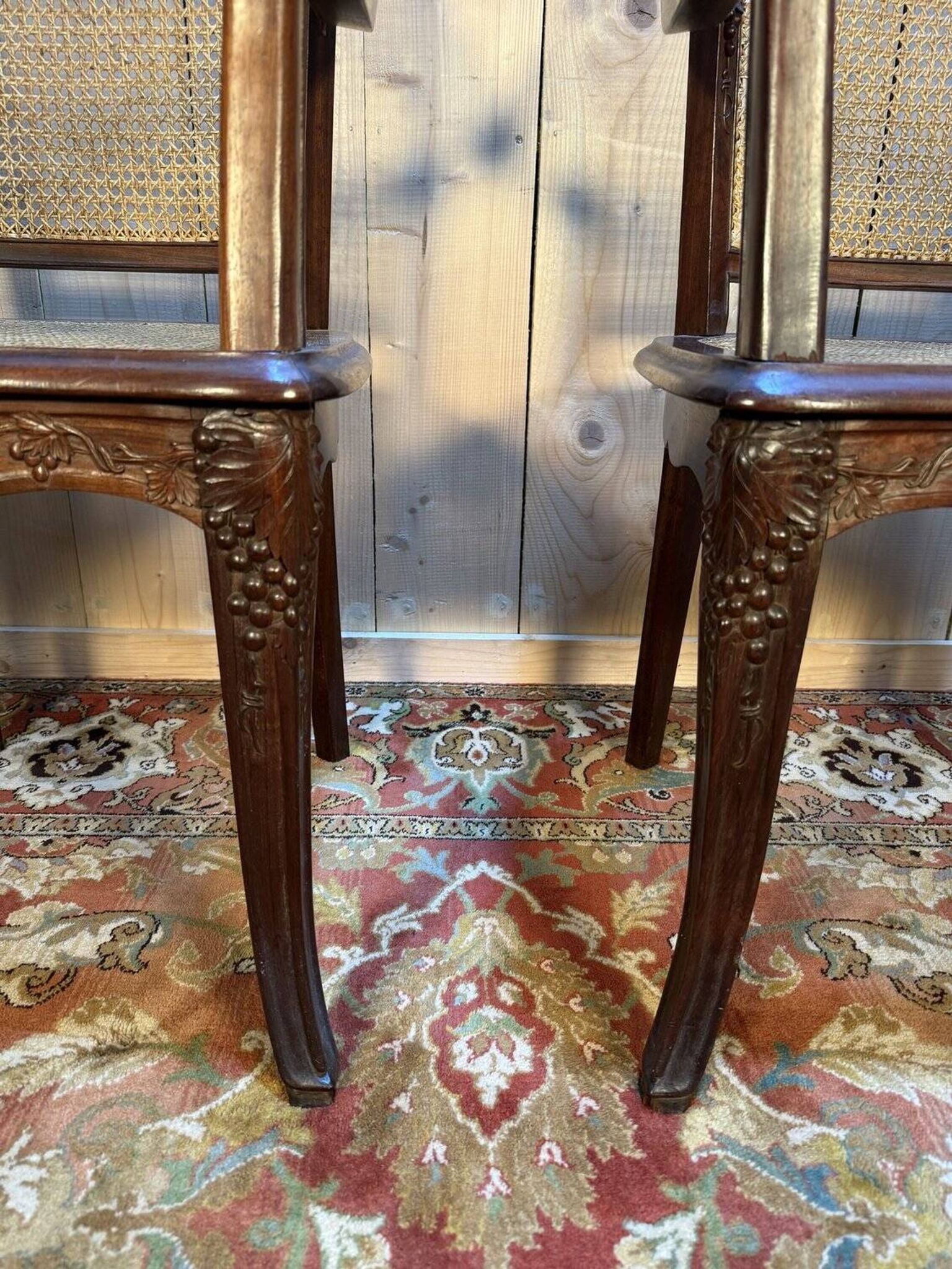 Pair of wide caned armchairs from the Art Nouveau period.