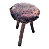 Rustic tripod stool seat covered with goatskin