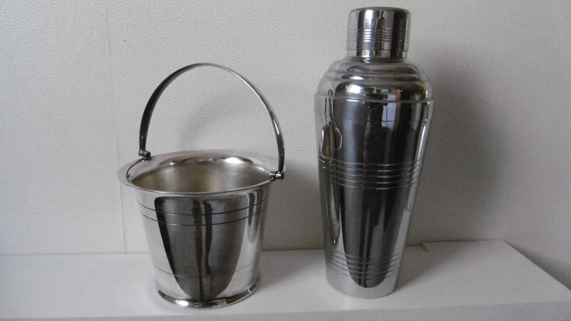 Silver metal shaker and ice bucket