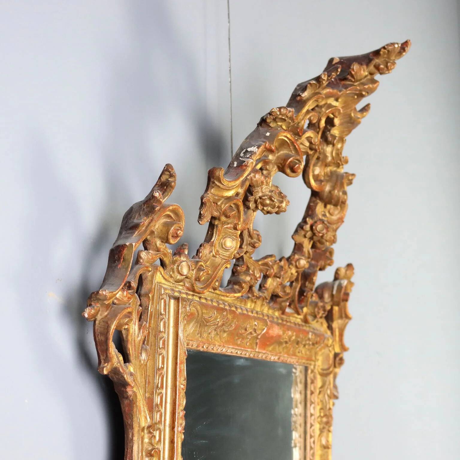 Antique carved and gilded wooden mirror, Italy, early 20th century.