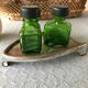 Salt/pepper green glass jars on metal base