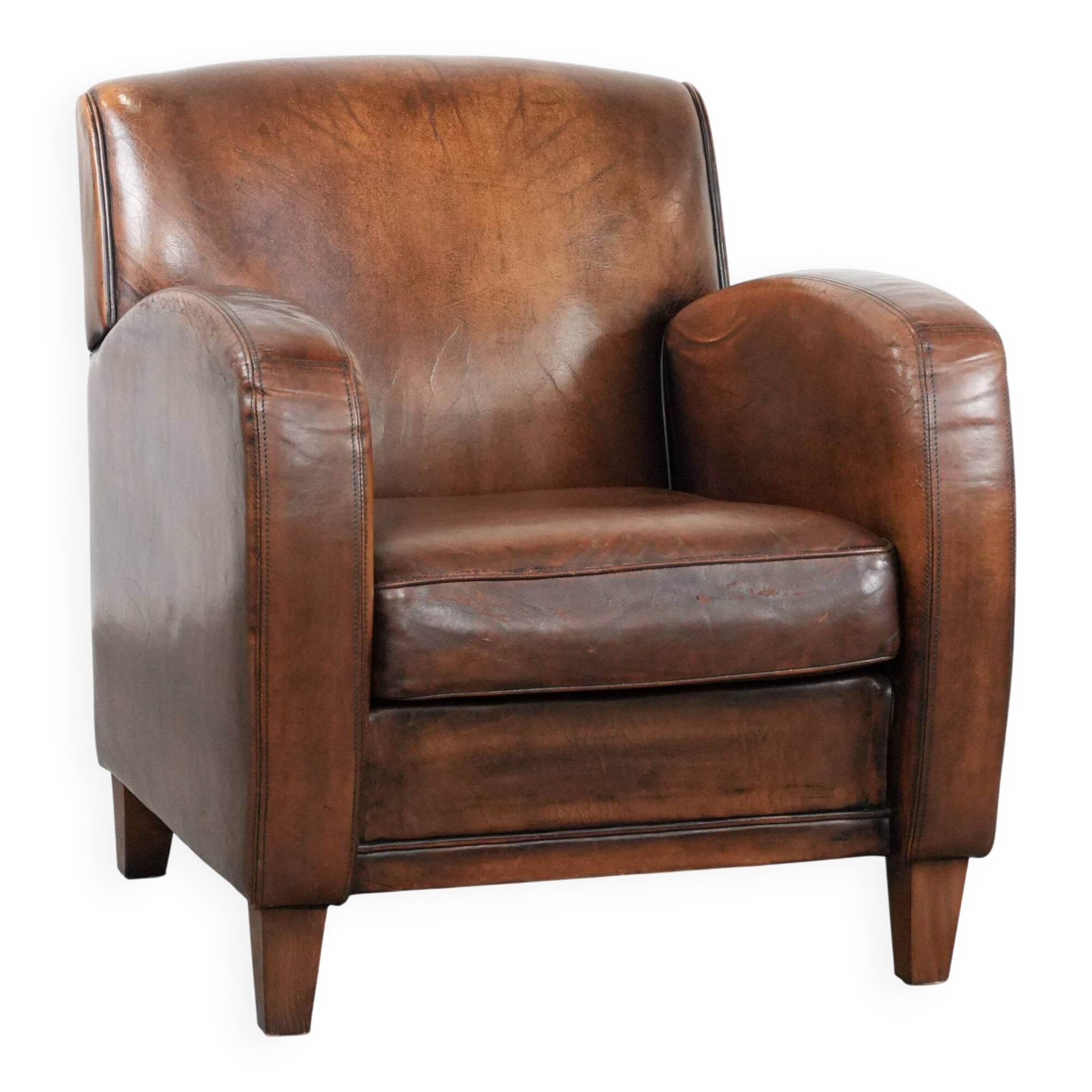 Characterful vintage sheepskin leather armchair with beautiful colours