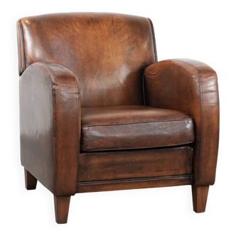 Characterful vintage sheepskin leather armchair with beautiful colours