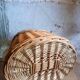 Covered rattan basket for lunch on 50s grass