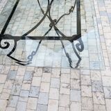Large rectangular table in cast iron and glass top