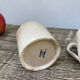 Duo of old beige Veillard Bordeaux coffee cups