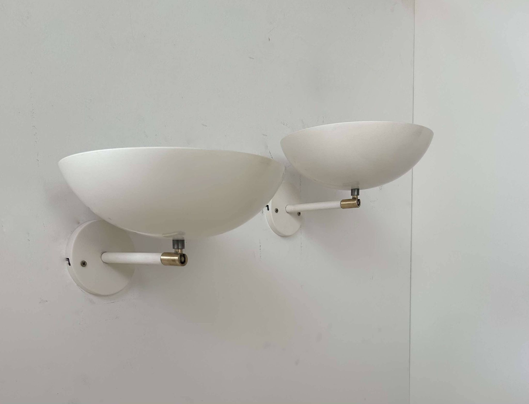 Pair of vintage adjustable wall lights, brass and white metal, France 1970
