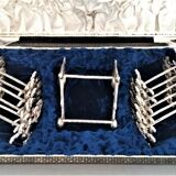 Twelve knife holders with ladle doors.