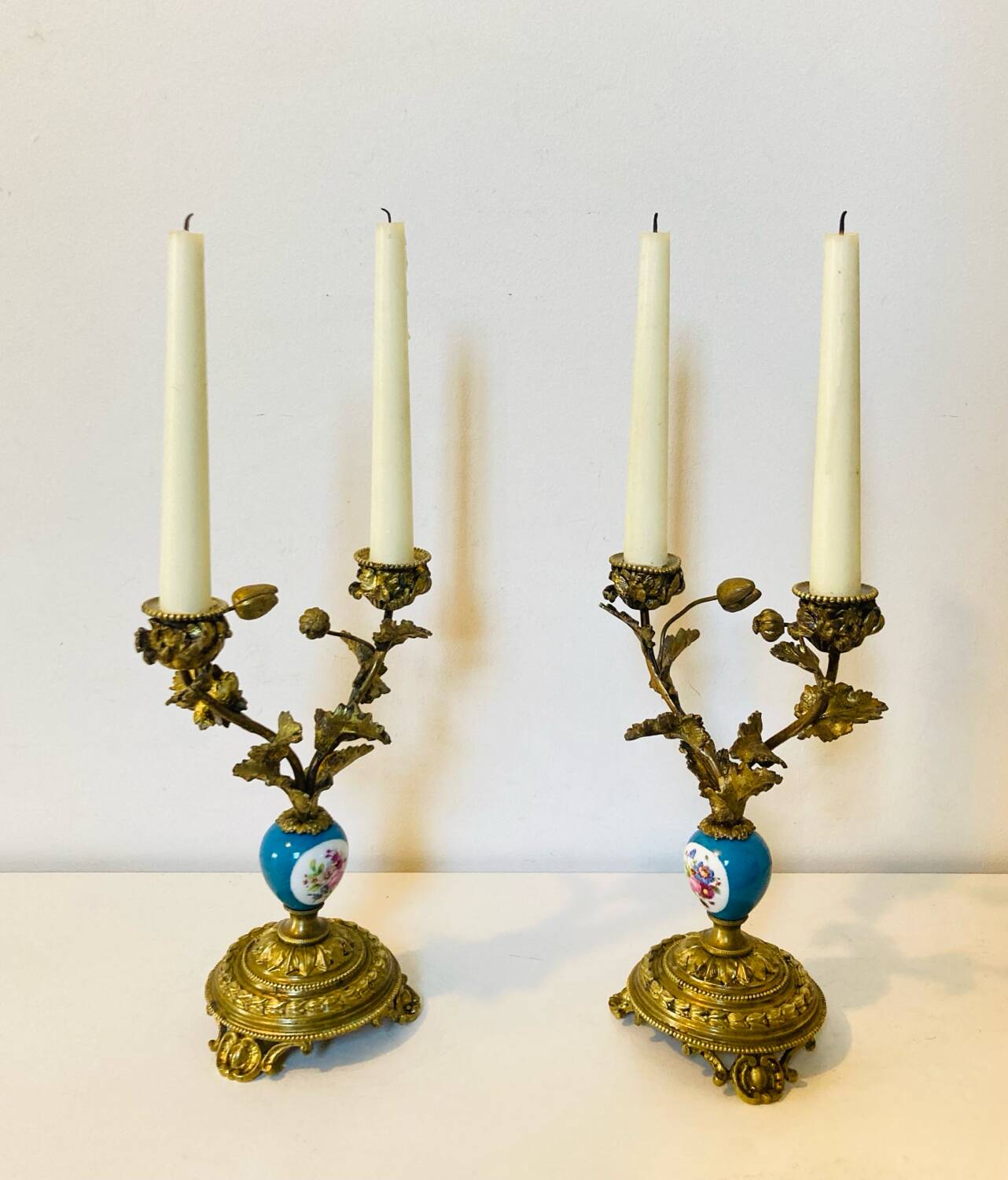 19th century candle holders in gilded bronze and porcelain