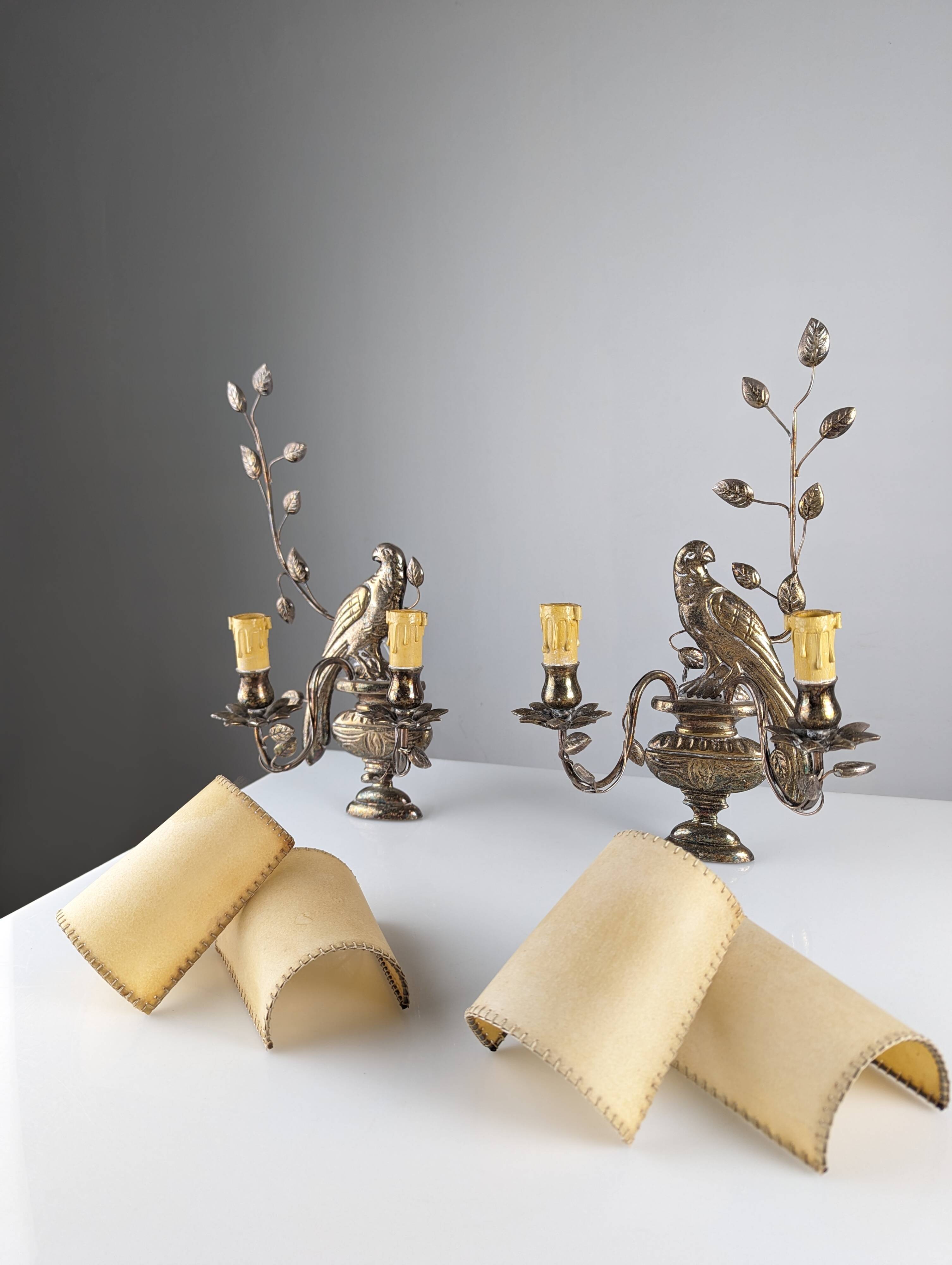 Pair of wall sconces with parrots and leaves