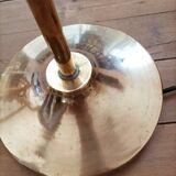 Bronze floor lamp with pine cone decoration.