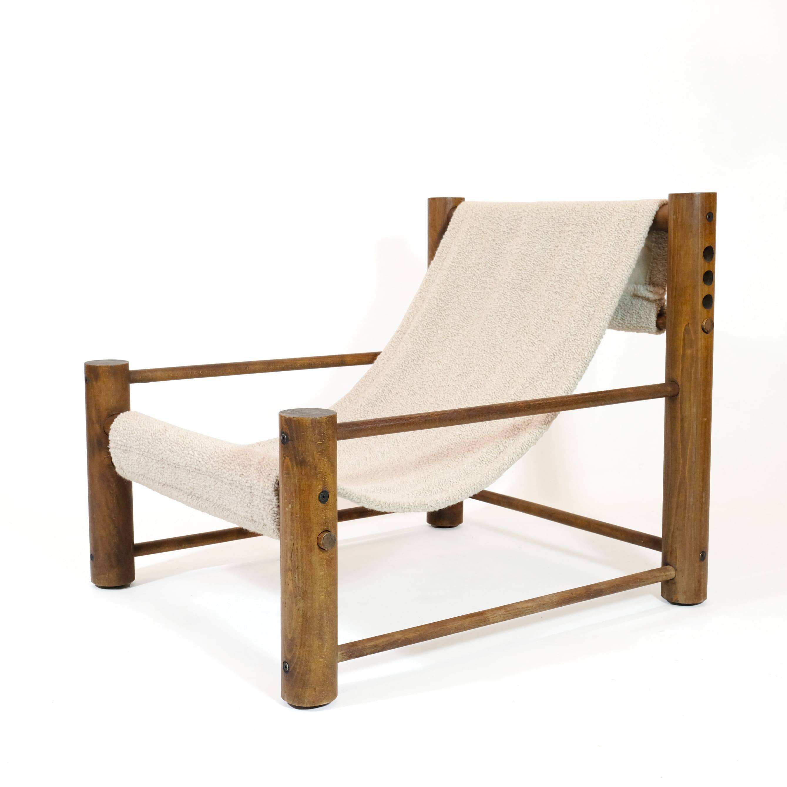 Solid wood armchair with adjustable backrest.