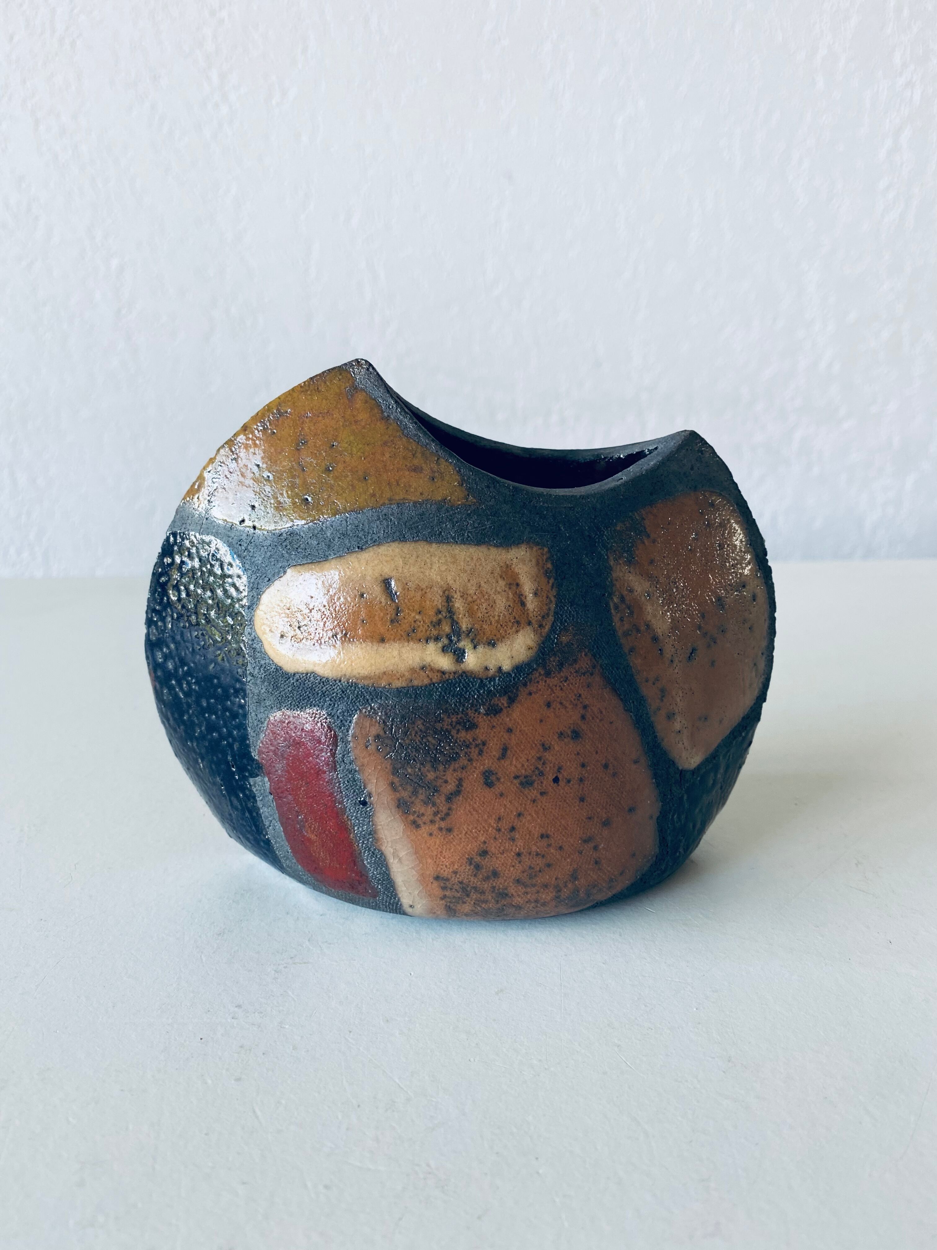 Enamelled ceramic lens vase