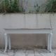 Console with a weathered grey cotton base, top in bleached walnut.