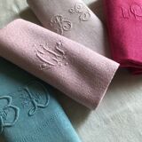 Suite of four antique tinted napkins