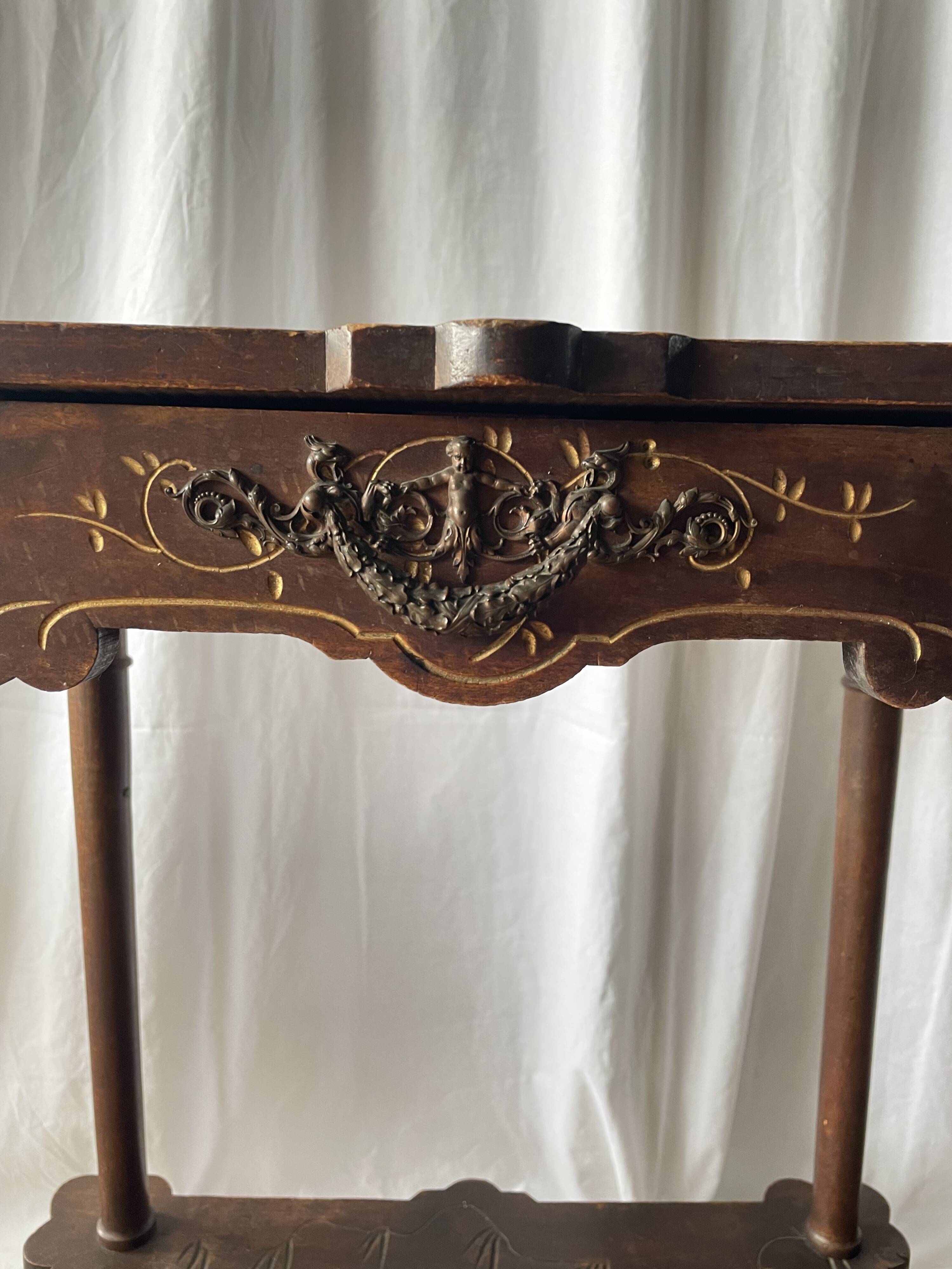 Elegant Art Nouveau side table in walnut, France early 20th century.