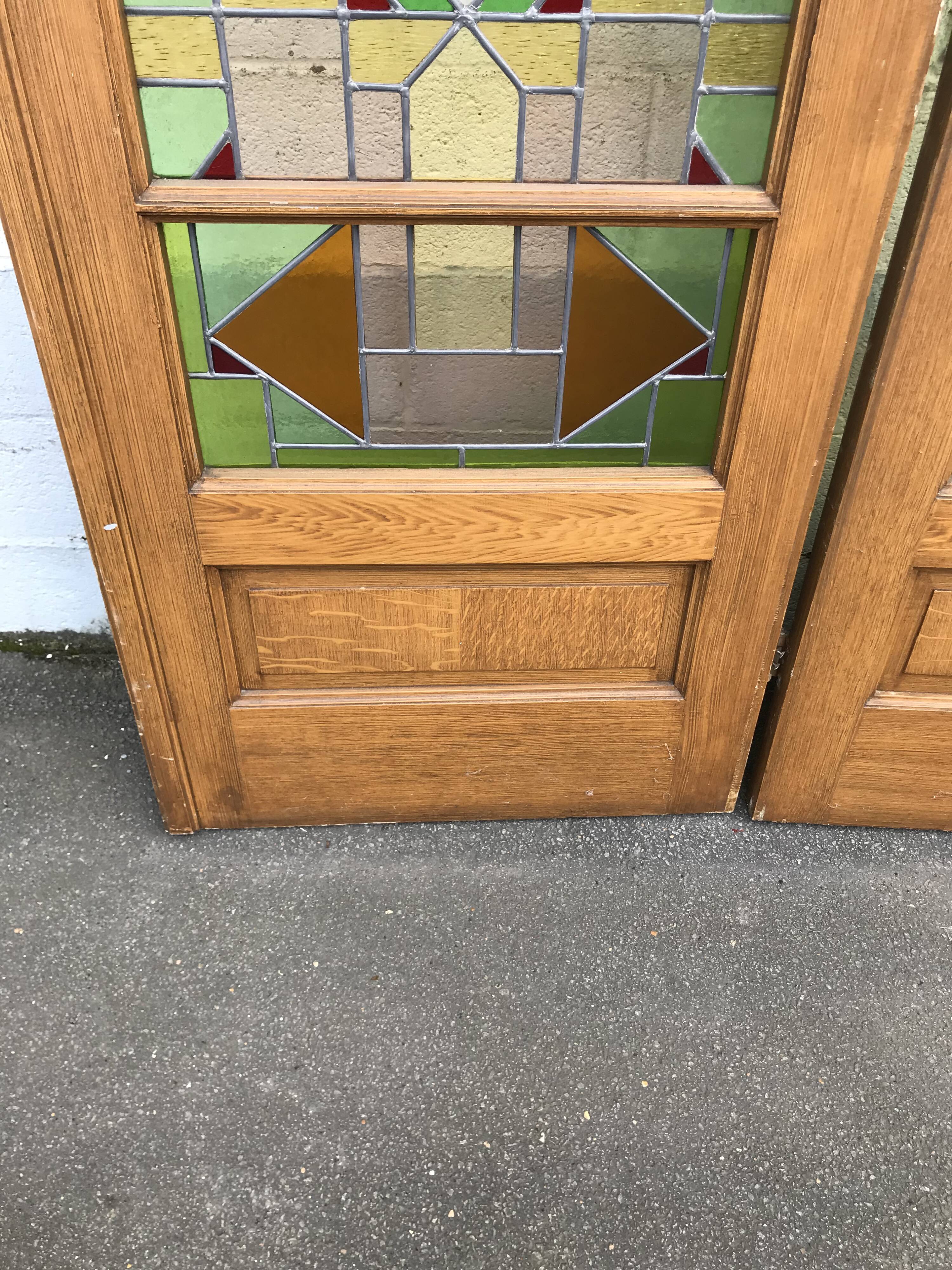 Series of three doors with stained glass windows