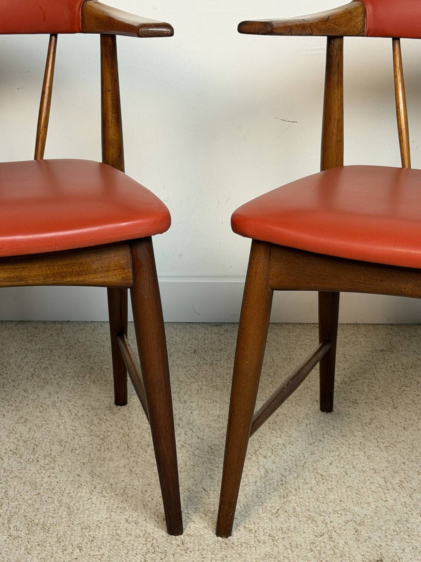 Pair of Scandinavian armchairs in teak and red faux leather – 1960s