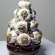 Vintage trompe-l'œil garlic pyramid in glazed ceramic from Manises, Spain.