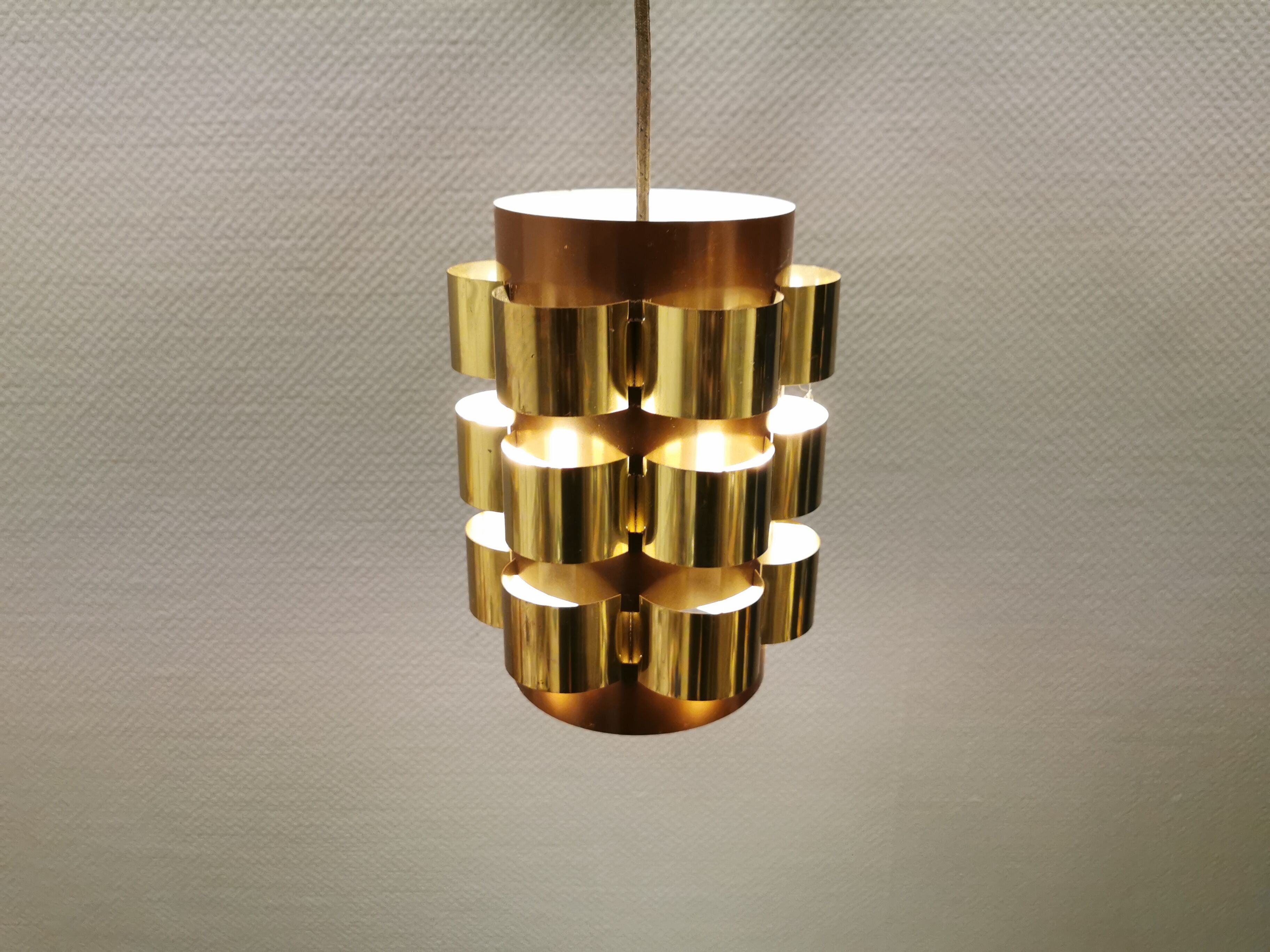 Danish hanging lamp from the 70s, in thin cut metal.