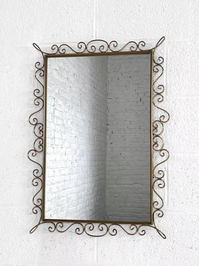 Rectangular mirror from the 50s-60s on a brass frame.
